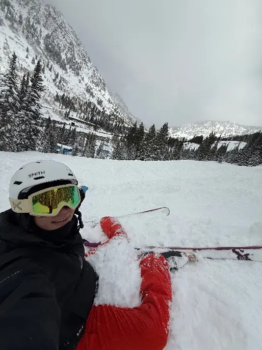 Milk taking a ski selfie in the snow